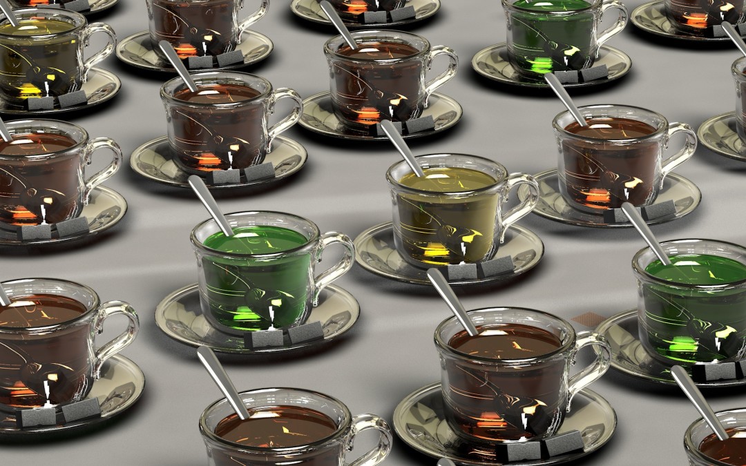 A bunch of glass teacups lined up in rows, with different colored tea, silver teaspoons, and sugar cubes on saucers.